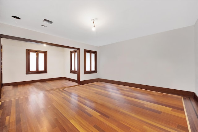 181 Walnut St, Lynbrook, NY 11563 - unfurnished room with baseboards and wood finished floors