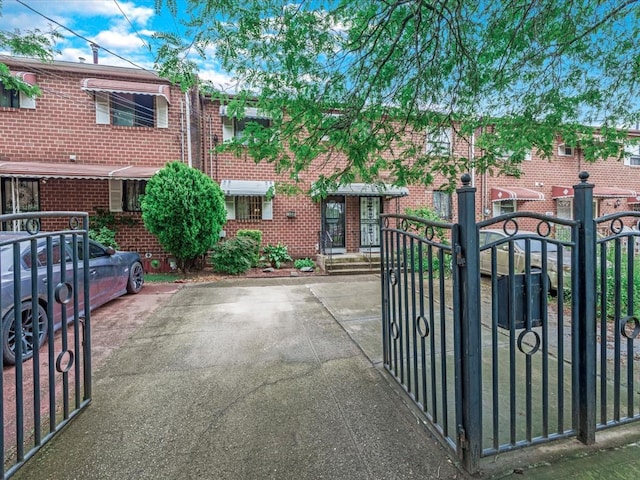 453 Christopher Ave, Brooklyn, NY 11212 - view of front facade with a gate and brick siding