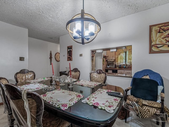 453 Christopher Ave, Brooklyn, NY 11212 - dining room featuring a chandelier and a textured ceiling