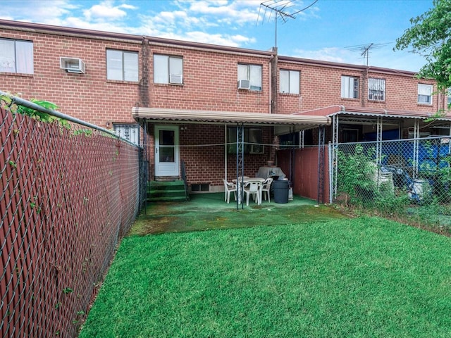 453 Christopher Ave, Brooklyn, NY 11212 - rear view of house featuring a fenced backyard, entry steps, and brick siding