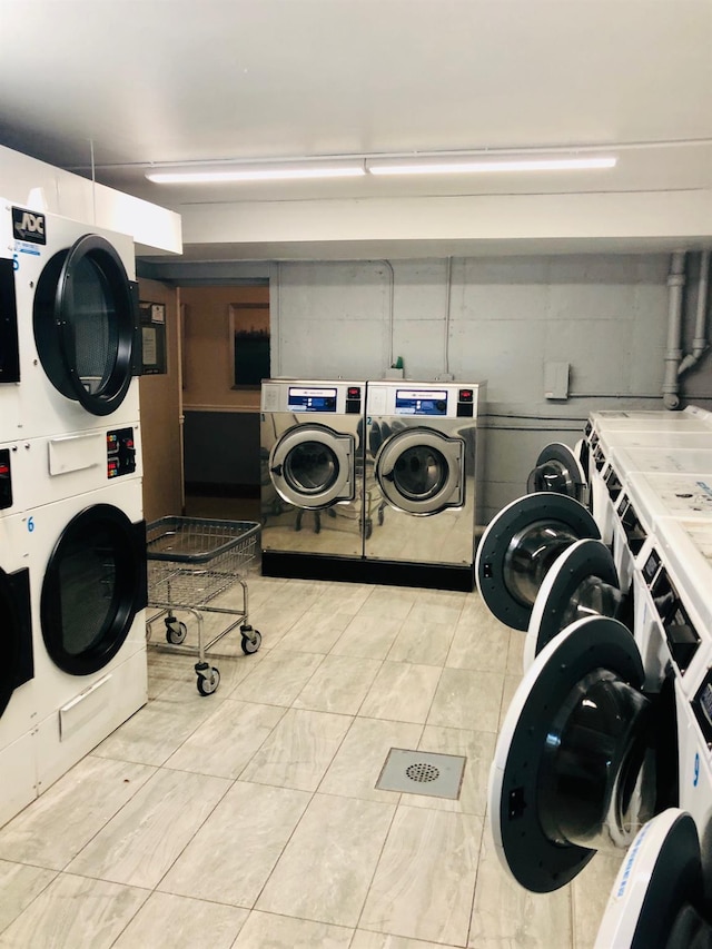 20 Secor Unit 5L, Yonkers, NY 10704 - communal laundry room with stacked washer / drying machine, washer and clothes dryer, and light tile patterned flooring