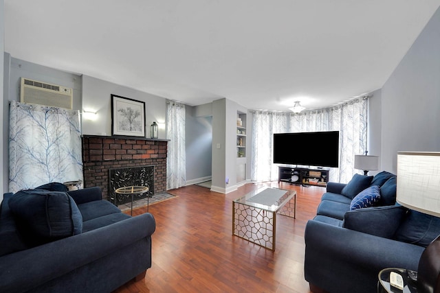 6851 Clyde St, Forest Hills, NY 11375 - living room featuring wood finished floors, a fireplace, and built in features