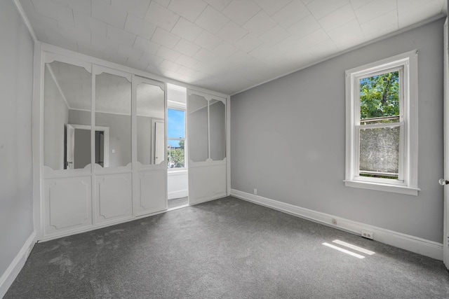 6851 Clyde St, Forest Hills, NY 11375 - empty room with dark colored carpet
