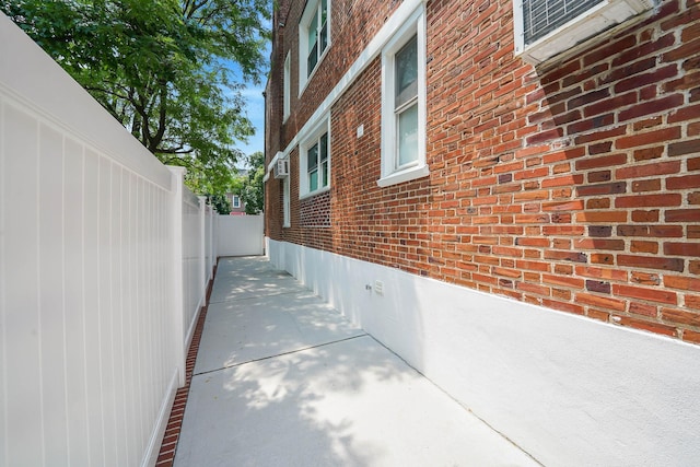 6851 Clyde St, Forest Hills, NY 11375 - view of property exterior featuring brick siding and crawl space