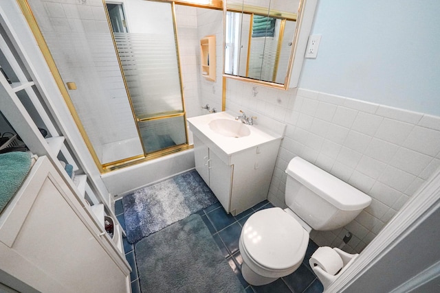 6851 Clyde St, Forest Hills, NY 11375 - bathroom with vanity, tile walls, enclosed tub / shower combo, and tile patterned floors