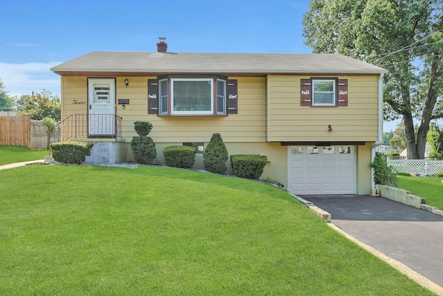 12 Malone Ave, Garnerville, NY 10923 - view of front facade featuring a garage, asphalt driveway, and a chimney