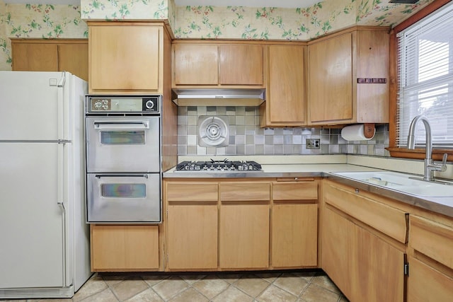 12 Malone Ave, Garnerville, NY 10923 - kitchen featuring freestanding refrigerator, multiple ovens, wallpapered walls, stainless steel gas cooktop, and light countertops