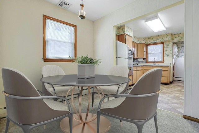12 Malone Ave, Garnerville, NY 10923 - dining room with wallpapered walls and a baseboard heating unit