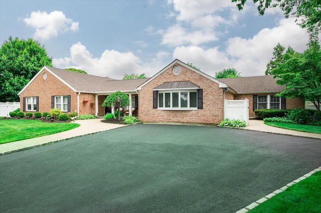 31-33 Dunlop Ct, Commack, NY 11725 - single story home featuring brick siding and asphalt driveway