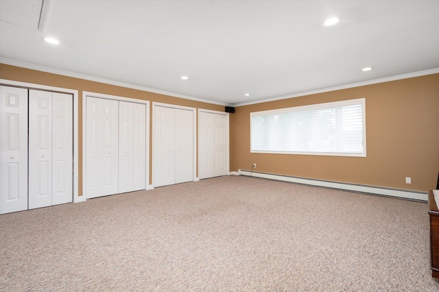 31-33 Dunlop Ct, Commack, NY 11725 - unfurnished bedroom featuring baseboard heating, two closets, ornamental molding, recessed lighting, and carpet floors