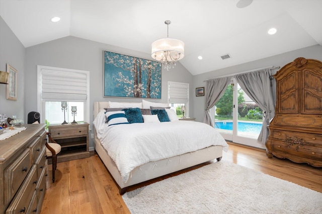 31-33 Dunlop Ct, Commack, NY 11725 - bedroom featuring vaulted ceiling, access to exterior, light wood-style flooring, a chandelier, and recessed lighting