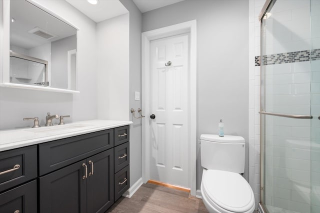 31-33 Dunlop Ct, Commack, NY 11725 - full bathroom featuring vanity, wood finished floors, and a shower stall