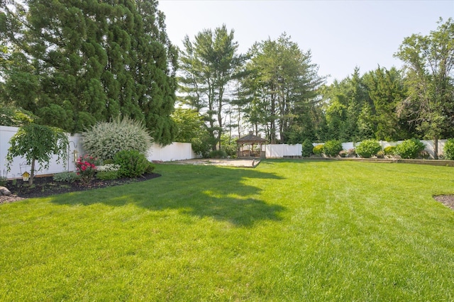 31-33 Dunlop Ct, Commack, NY 11725 - fenced backyard featuring a gazebo
