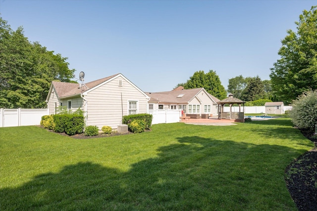 31-33 Dunlop Ct, Commack, NY 11725 - rear view of house with a gazebo, a fenced backyard, and a patio area