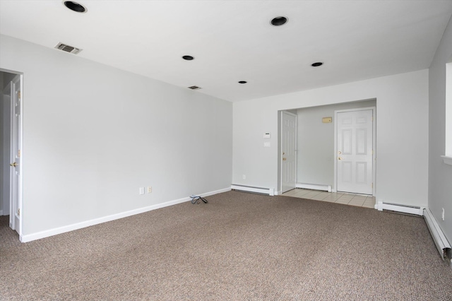 31-33 Dunlop Ct, Commack, NY 11725 - unfurnished room featuring light colored carpet, baseboard heating, and a baseboard heating unit