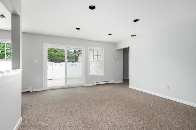 31-33 Dunlop Ct, Commack, NY 11725 - carpeted spare room featuring a baseboard heating unit, a baseboard radiator, plenty of natural light, and recessed lighting