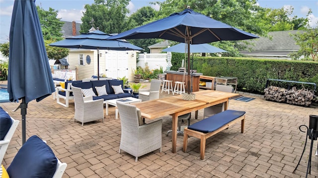 16 Clement St, Glen Cove, NY 11542 - view of patio / terrace with an outdoor living space, outdoor dining space, an outdoor structure, and a grill
