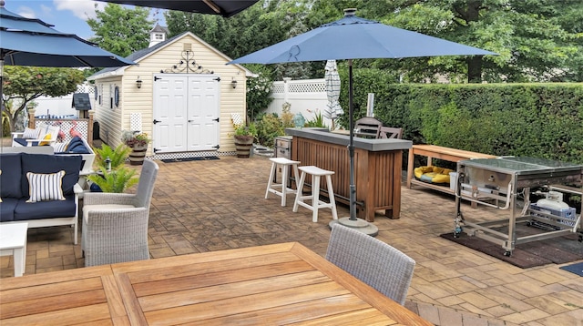 16 Clement St, Glen Cove, NY 11542 - wooden terrace featuring a patio, outdoor lounge area, and an outbuilding