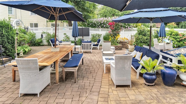 16 Clement St, Glen Cove, NY 11542 - fenced backyard featuring outdoor dining area and a patio area