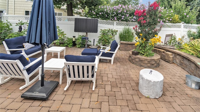 16 Clement St, Glen Cove, NY 11542 - fenced backyard featuring a patio area and an outdoor hangout area