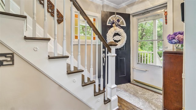 16 Clement St, Glen Cove, NY 11542 - foyer featuring stairway, ornamental molding, and wood finished floors