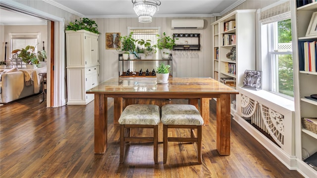 16 Clement St, Glen Cove, NY 11542 - dining space with a wall mounted air conditioner, dark wood-type flooring, and crown molding