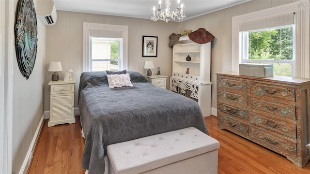16 Clement St, Glen Cove, NY 11542 - bedroom featuring a wall mounted AC, wood finished floors, and ornamental molding