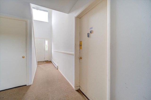1109 Cherry Hill Dr Unit 1109, Poughkeepsie, NY 12603 - hallway with a baseboard radiator, healthy amount of natural light, and light carpet