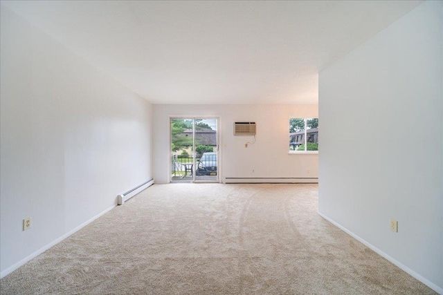 1109 Cherry Hill Dr Unit 1109, Poughkeepsie, NY 12603 - spare room featuring a baseboard heating unit, a baseboard radiator, carpet floors, and a wall mounted air conditioner