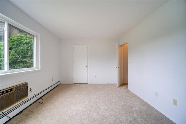 1109 Cherry Hill Dr Unit 1109, Poughkeepsie, NY 12603 - unfurnished room featuring a baseboard heating unit and light colored carpet