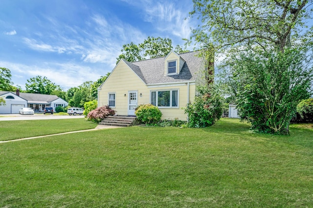 4 Jones St N, Patchogue, NY 11772 - cape cod home with a front lawn and roof with shingles