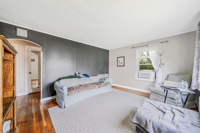 4 Jones St N, Patchogue, NY 11772 - bedroom featuring arched walkways, hardwood / wood-style flooring, cooling unit, and crown molding