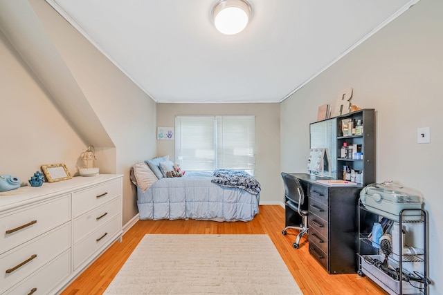 4 Jones St N, Patchogue, NY 11772 - bedroom featuring crown molding, light wood-style floors, and an office area