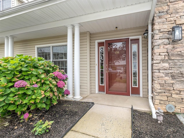 195 Pond View Dr Unit Ca0208, Port Washington, NY 11050 - property entrance featuring a porch and stone siding