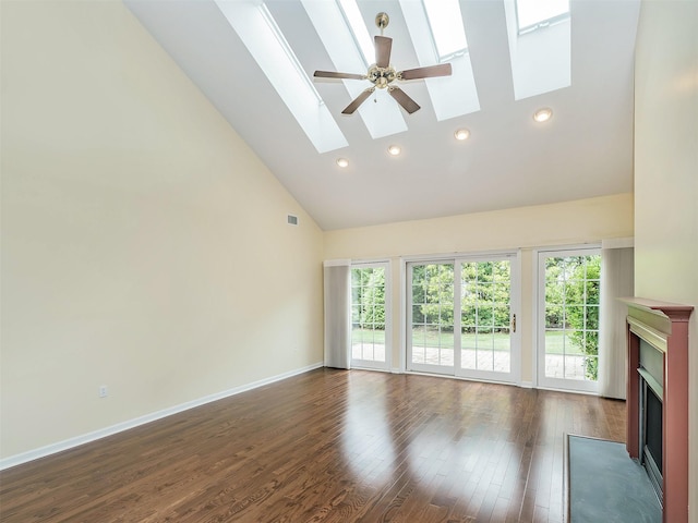 195 Pond View Dr Unit Ca0208, Port Washington, NY 11050 - unfurnished living room featuring high vaulted ceiling, a fireplace with flush hearth, a skylight, dark wood finished floors, and recessed lighting