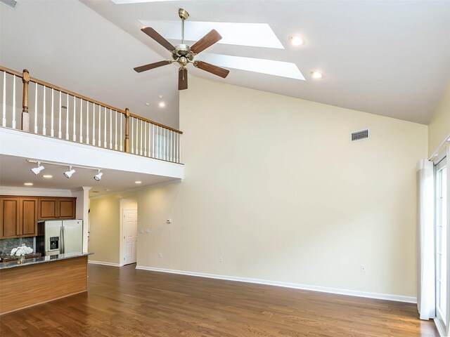 195 Pond View Dr Unit Ca0208, Port Washington, NY 11050 - unfurnished living room featuring a skylight, high vaulted ceiling, a ceiling fan, and dark wood-style flooring