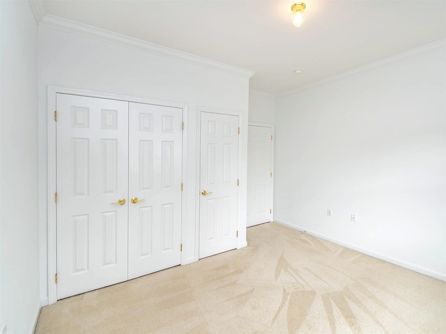 195 Pond View Dr Unit Ca0208, Port Washington, NY 11050 - unfurnished bedroom featuring crown molding, carpet flooring, and a closet