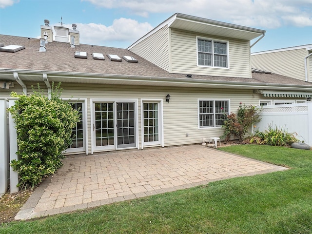 195 Pond View Dr Unit Ca0208, Port Washington, NY 11050 - back of property featuring a patio area, roof with shingles, and a chimney