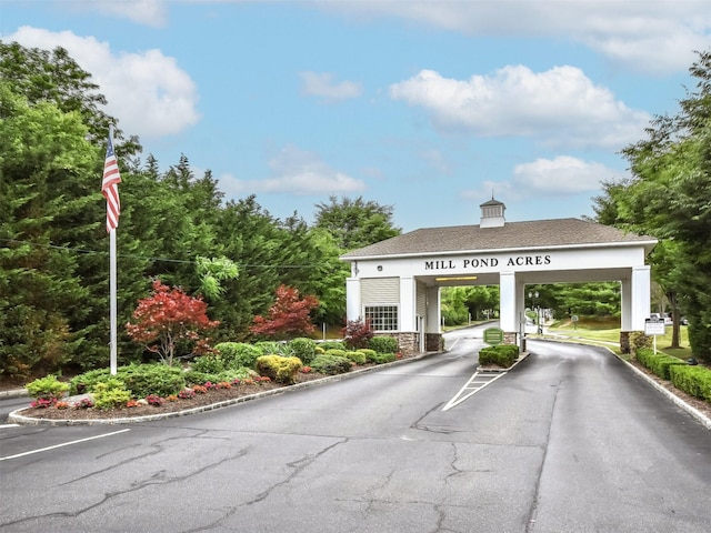 195 Pond View Dr Unit Ca0208, Port Washington, NY 11050 - view of asphalt street with a gated entry and curbs