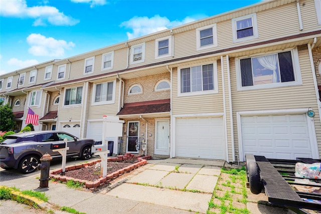 21 Carol Pl, Staten Island, NY 10303 - view of property featuring an attached garage and driveway