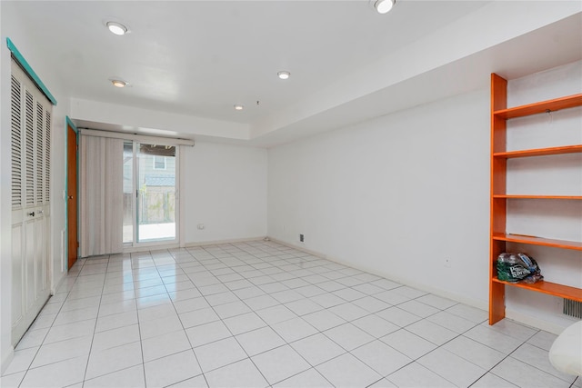 21 Carol Pl, Staten Island, NY 10303 - unfurnished bedroom with recessed lighting, light tile patterned floors, and a closet