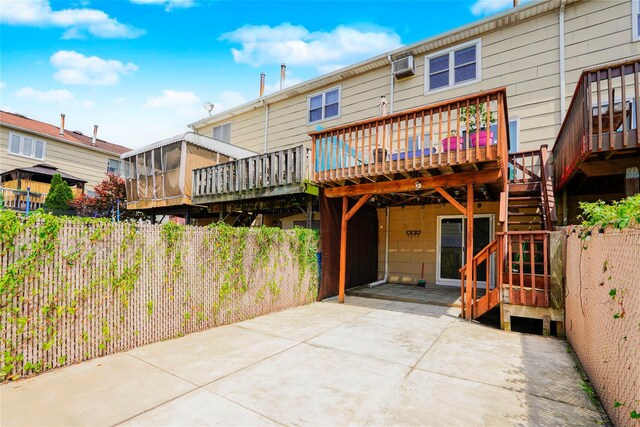 21 Carol Pl, Staten Island, NY 10303 - rear view of property with a deck, stairway, and a wall mounted AC