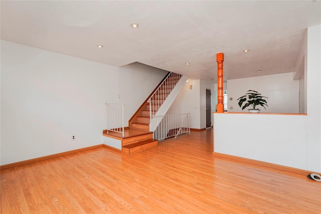 21 Carol Pl, Staten Island, NY 10303 - unfurnished living room featuring light wood-type flooring, stairs, and recessed lighting