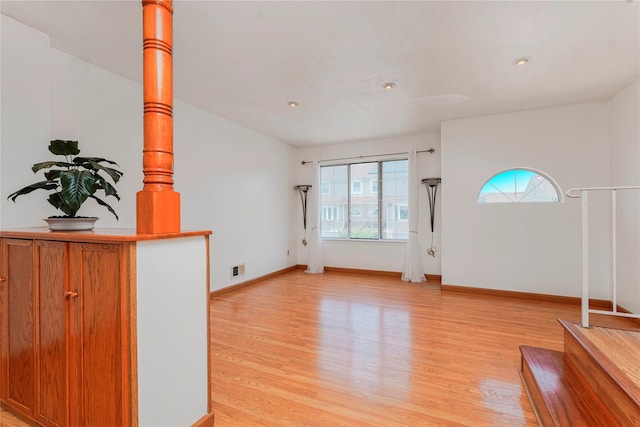 21 Carol Pl, Staten Island, NY 10303 - unfurnished living room with light wood finished floors, plenty of natural light, and recessed lighting