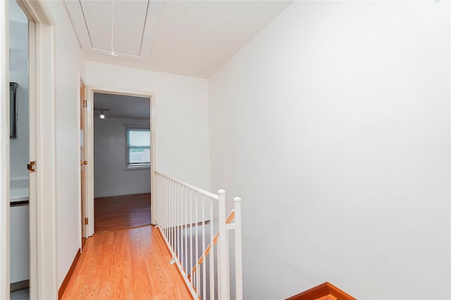 21 Carol Pl, Staten Island, NY 10303 - hallway featuring attic access, an upstairs landing, and light wood-style flooring