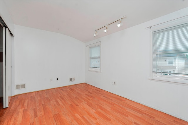 21 Carol Pl, Staten Island, NY 10303 - spare room with light wood-style flooring, plenty of natural light, and track lighting