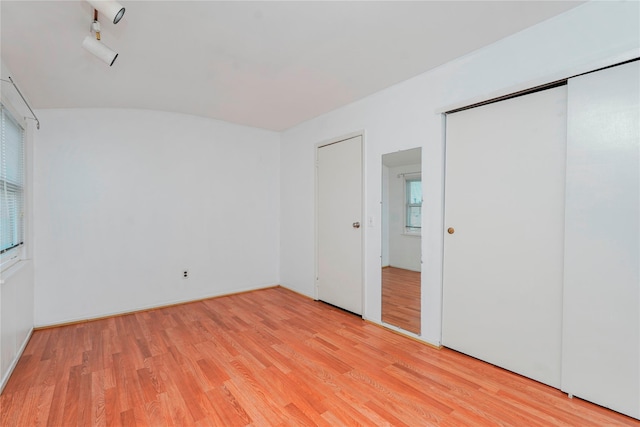 21 Carol Pl, Staten Island, NY 10303 - unfurnished bedroom featuring light wood-type flooring