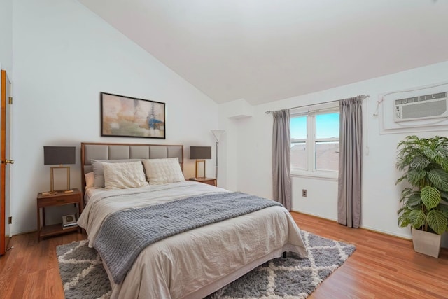 21 Carol Pl, Staten Island, NY 10303 - bedroom with an AC wall unit, lofted ceiling, and light wood-style floors