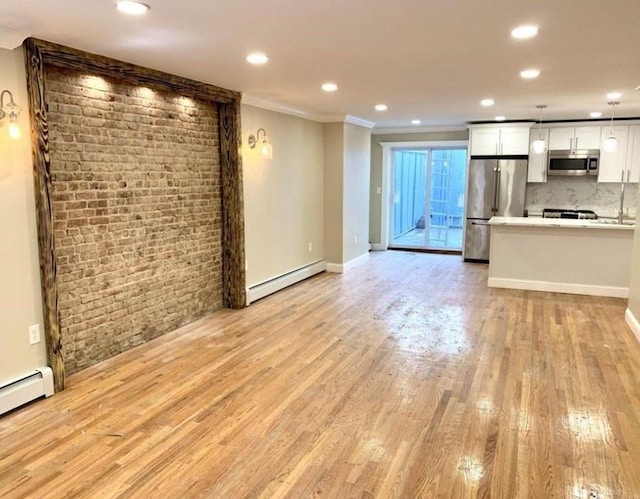 2301 Bathgate Ave, Bronx, NY 10458 - unfurnished living room with a baseboard radiator, crown molding, light wood-type flooring, recessed lighting, and brick wall