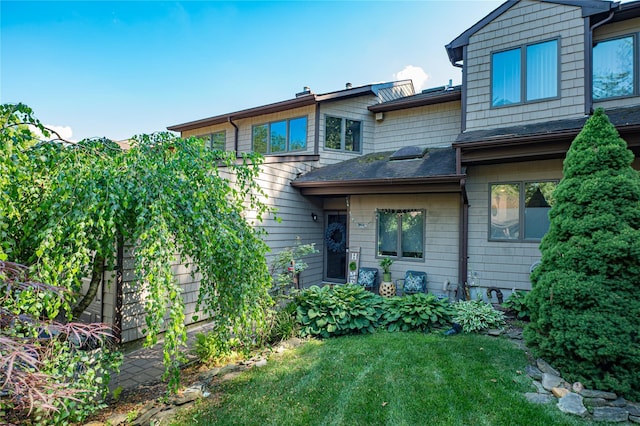60 Jeremy Cir, Nesconset, NY 11767 - back of house with a yard and roof with shingles